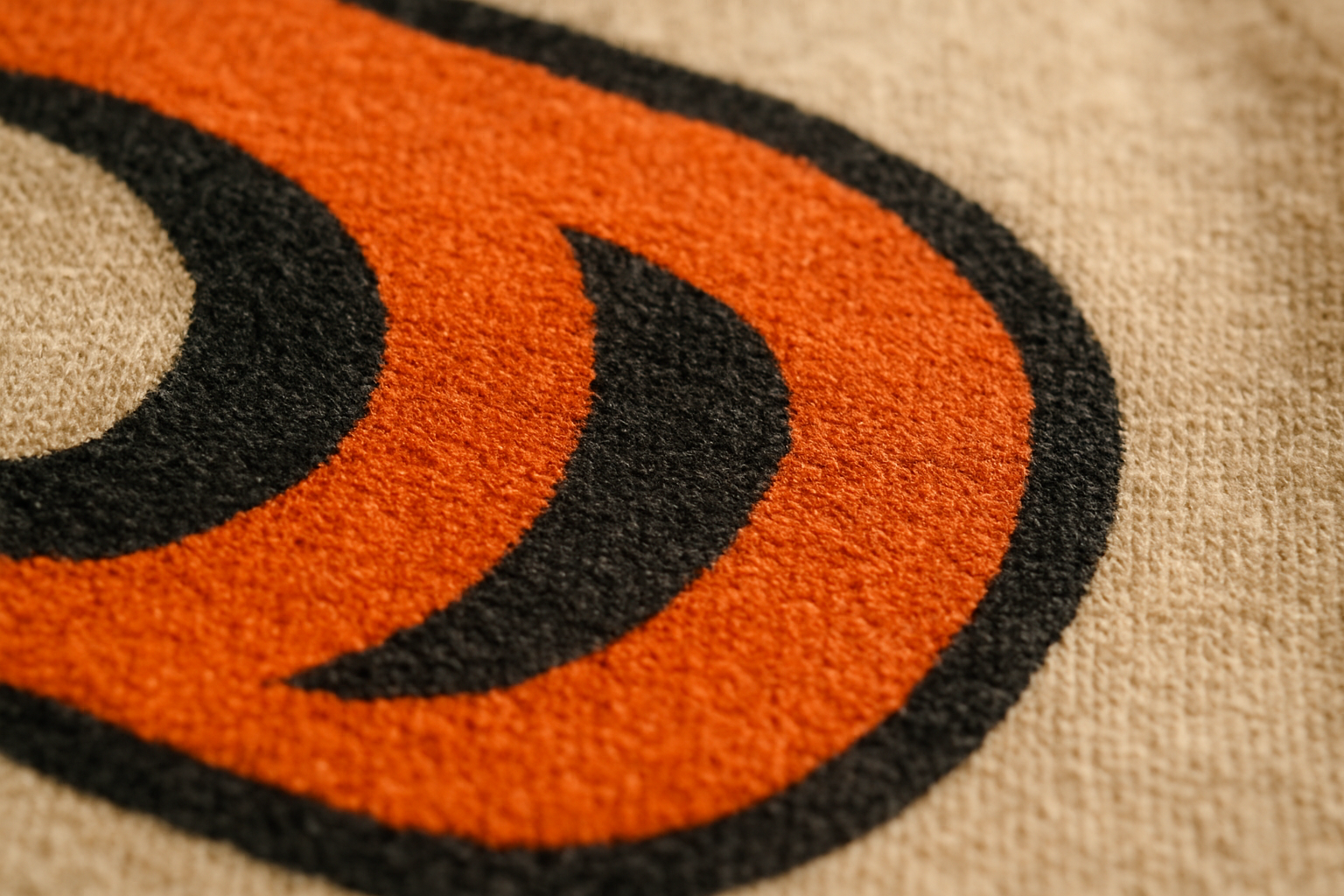 Close-up of vibrant screen-printed ink texture on premium cotton fabric