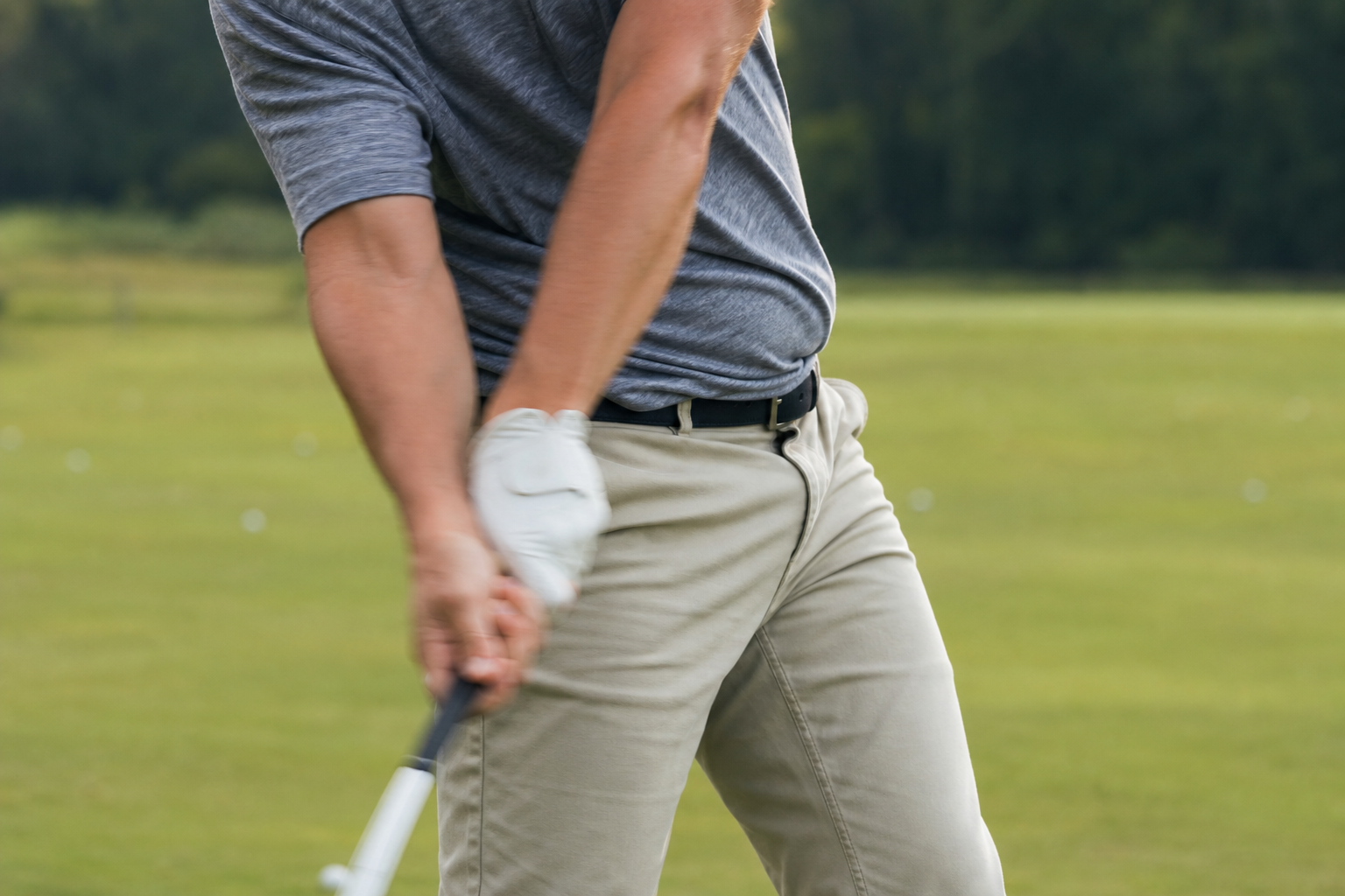 Golfer demonstrating hip rotation mechanics during a swing biomechanics lesson