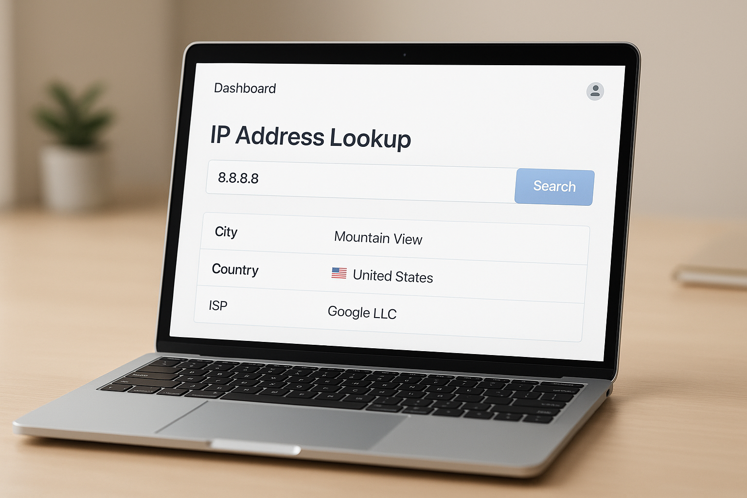 Laptop screen displaying an IP address location lookup dashboard showing city, country, and ISP details