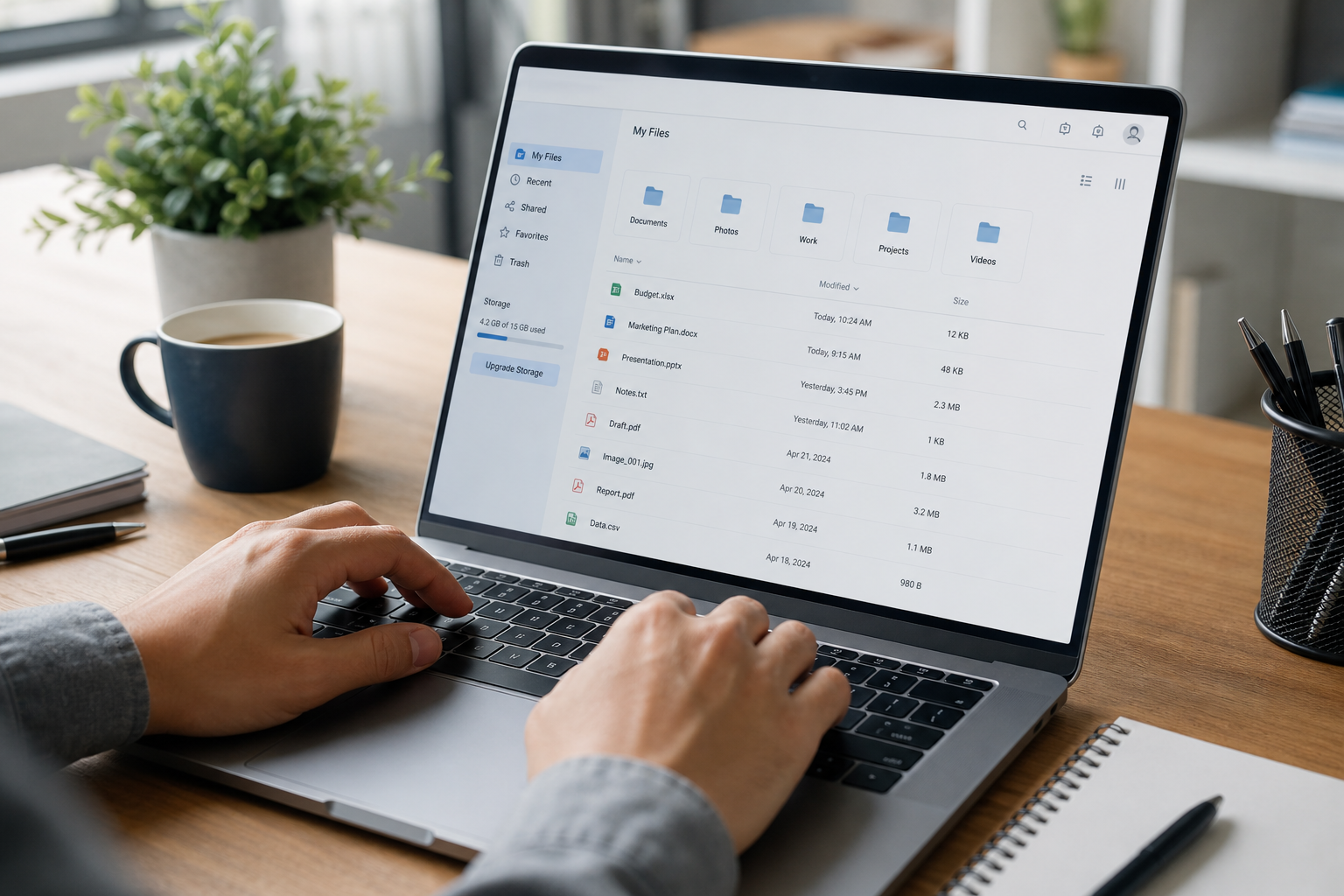 Close-up of hands using cloud file storage within a business operations platform