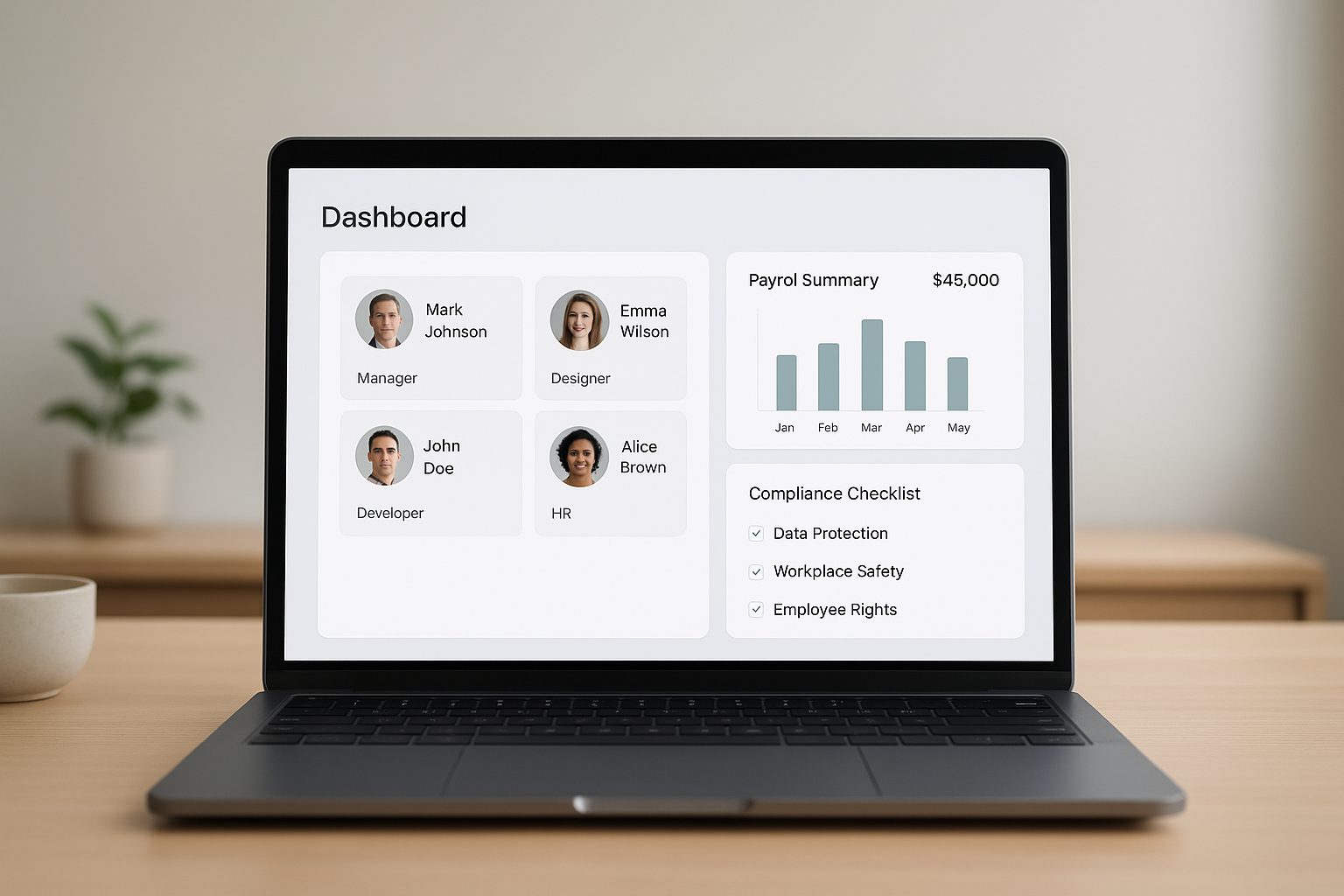 Laptop screen showing a cloud HR system dashboard with employee and payroll data