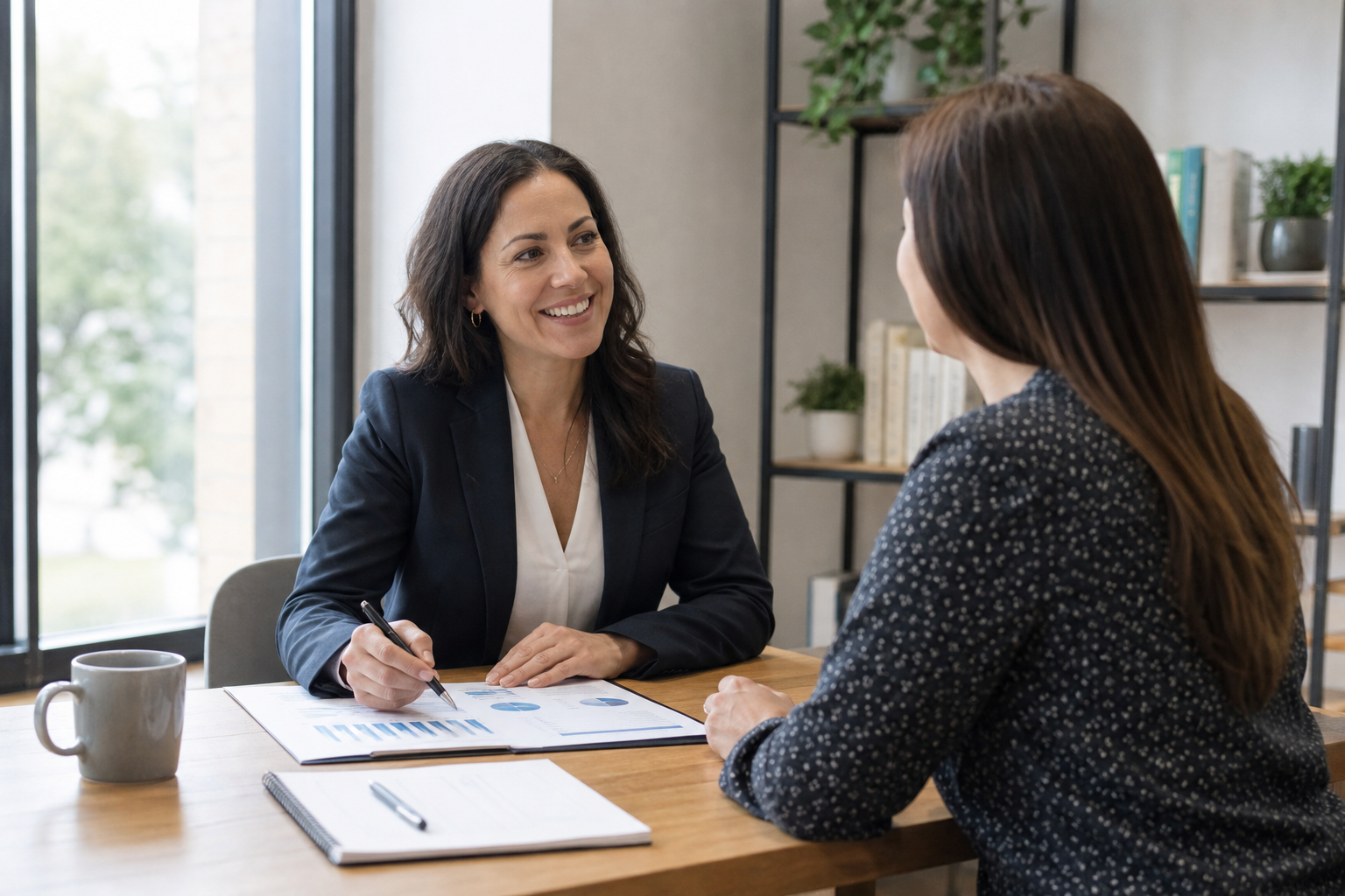 Business owner meeting with an HR consultant about benefits administration and compliance