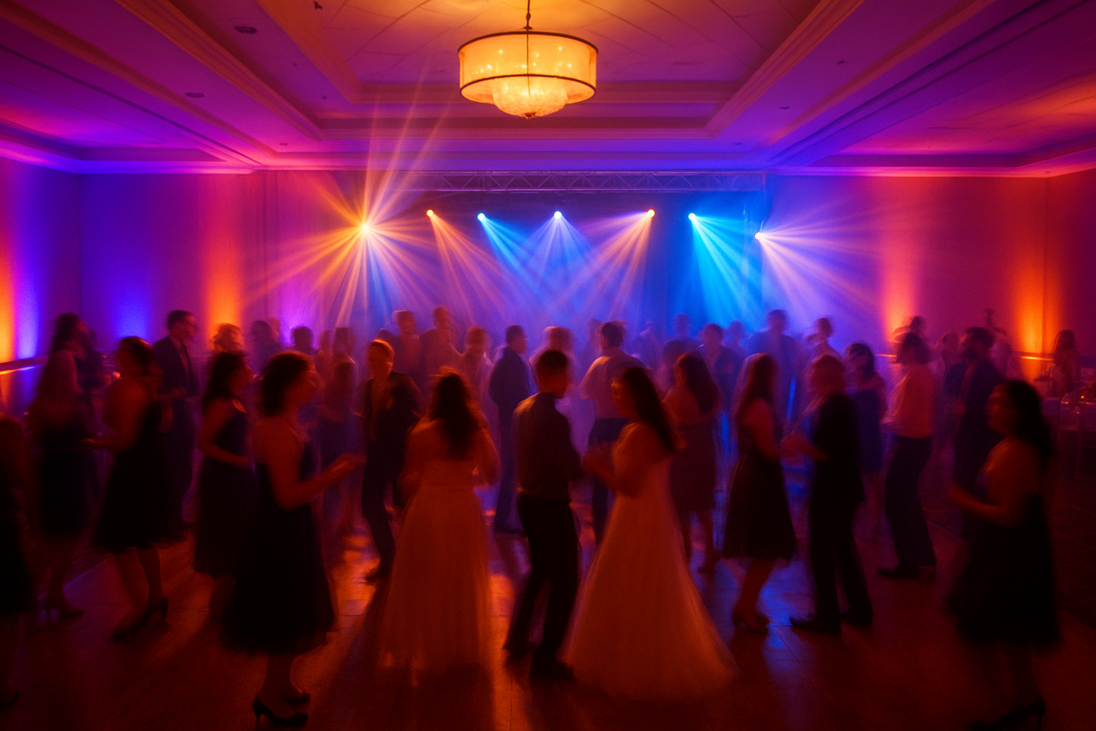 Wedding reception dance floor lit with music-responsive event lighting