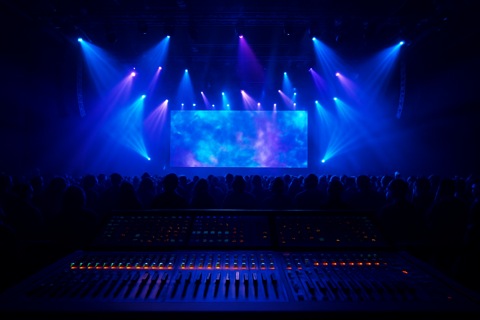 Professional audio visual production services setup at a large live event with LED wall and stage lighting
