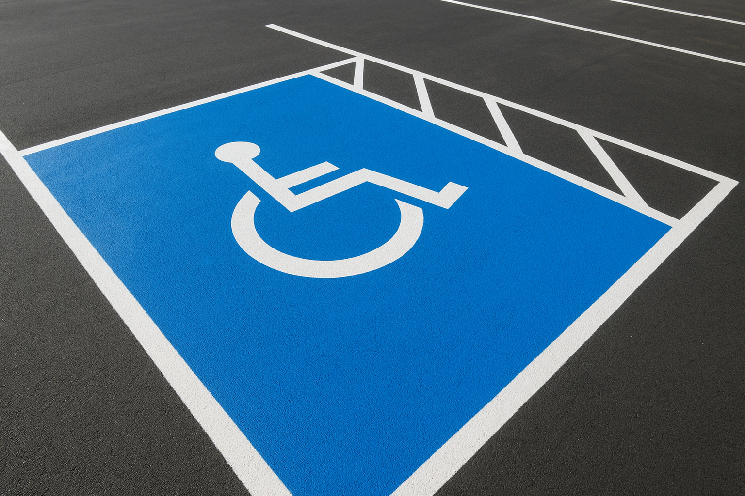 Freshly painted ADA handicap parking stall striping in a Plano parking lot