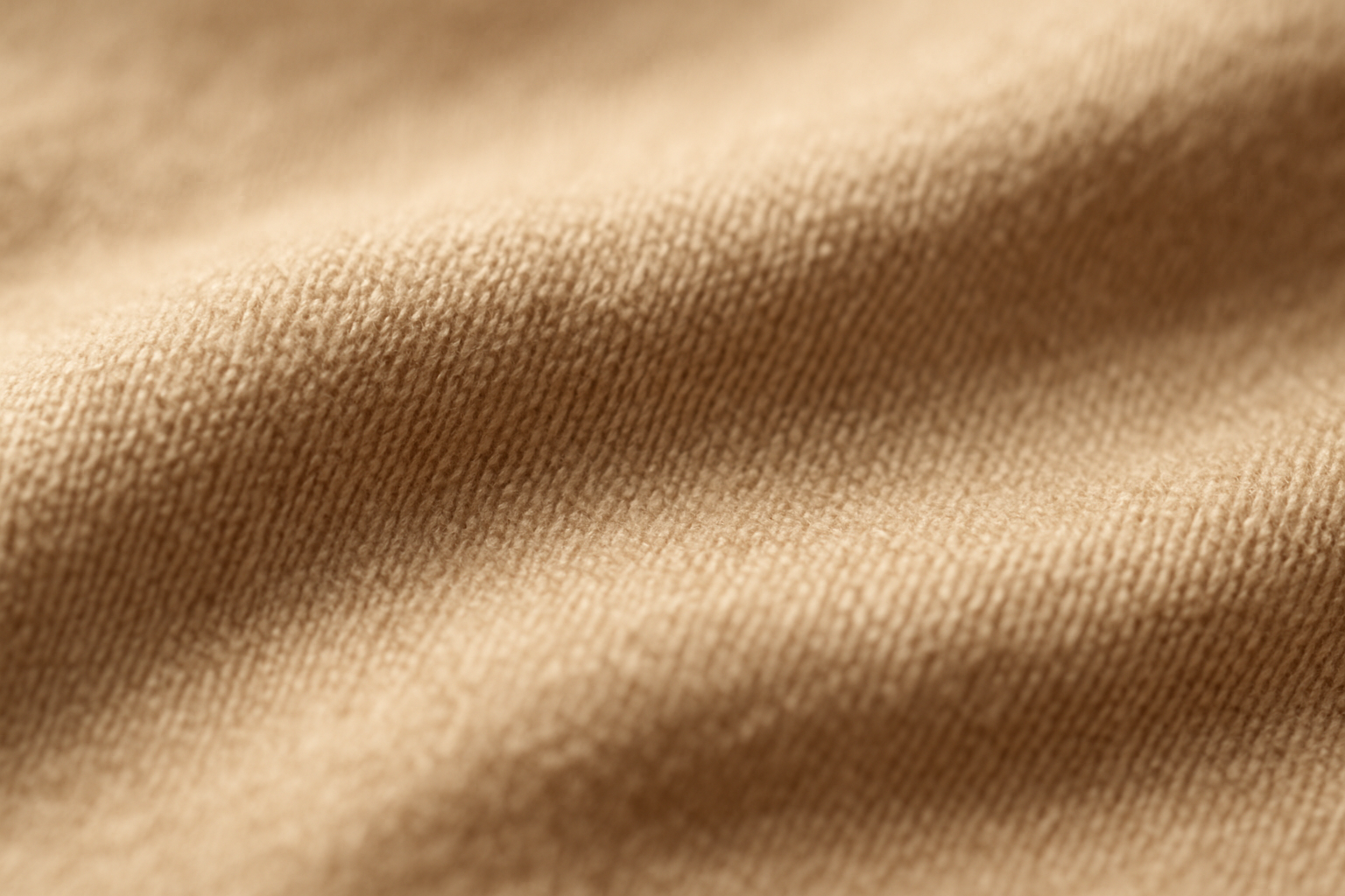 Close-up of soft fabric for t-shirts showing fine, tightly knit cotton fibers