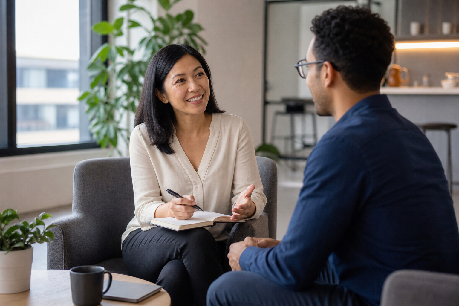 Manager holding a one-on-one check-in conversation with an employee