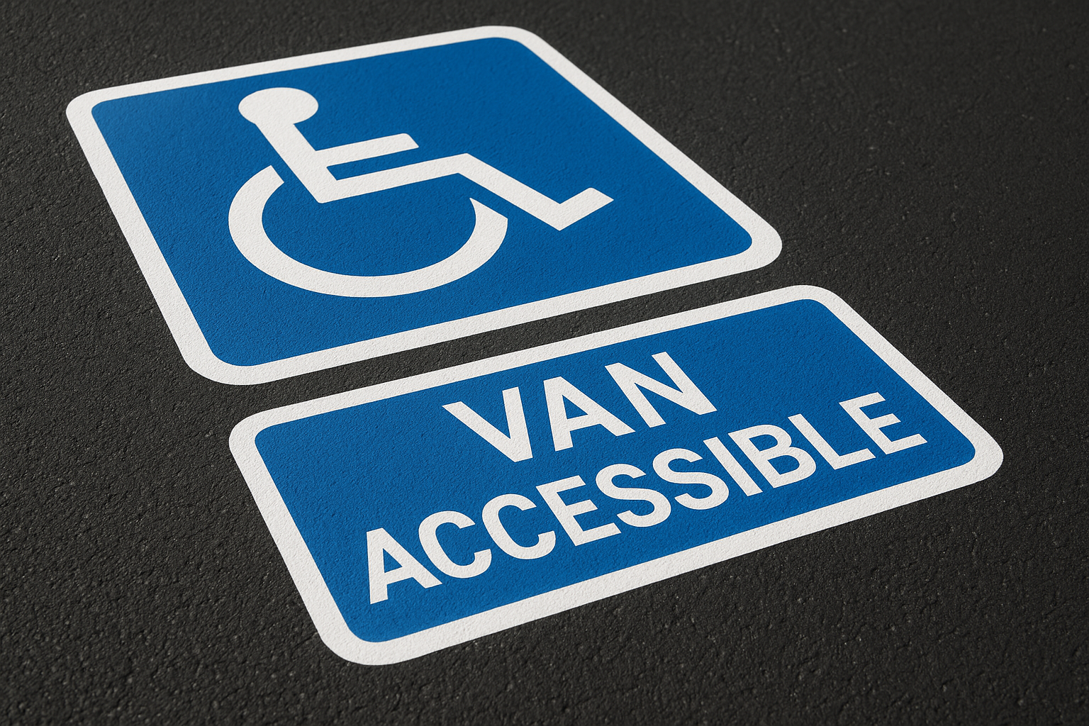 Freshly painted ADA compliant handicap parking symbol on commercial asphalt lot